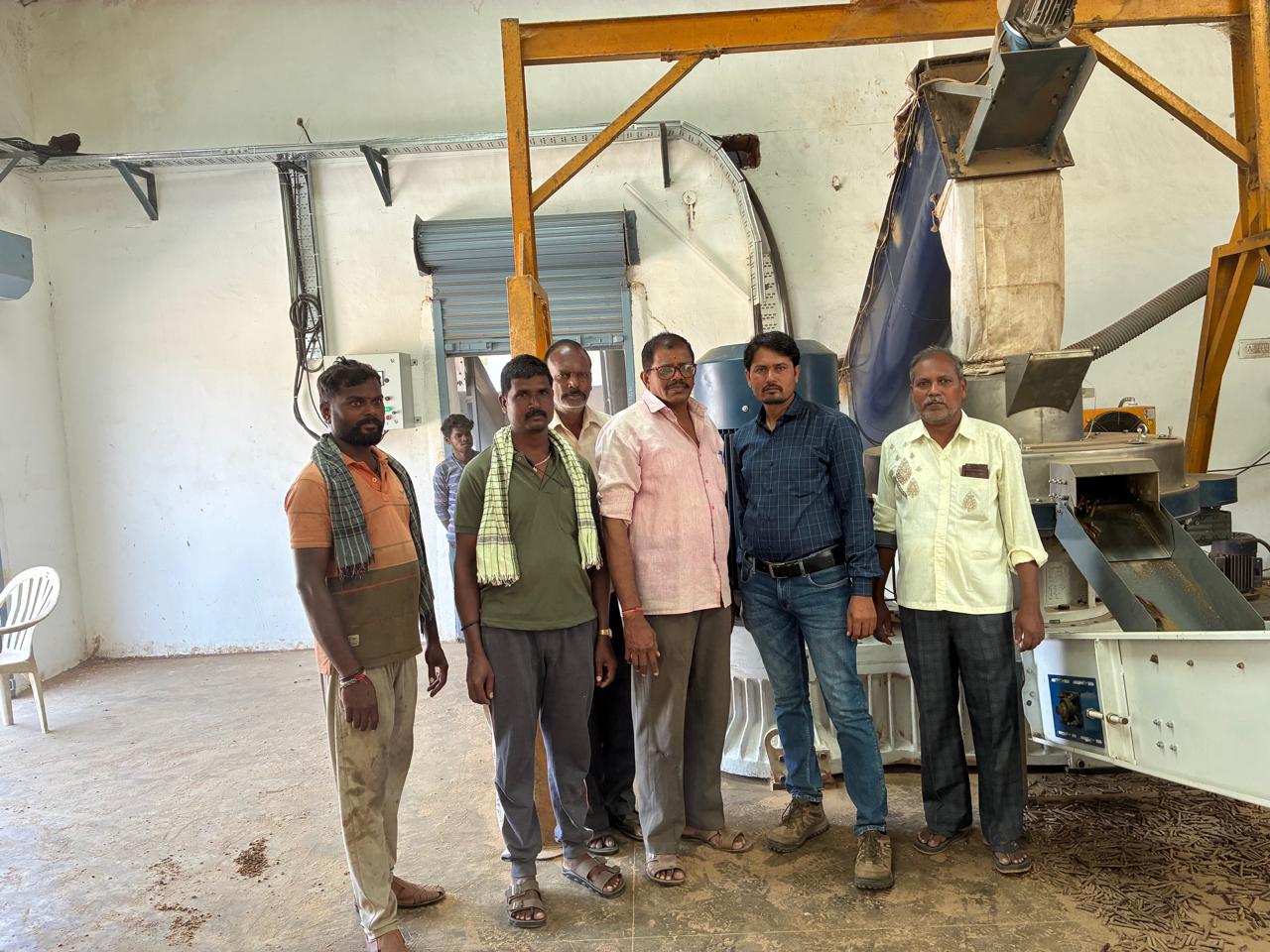 Biomass Pellet Plant Manufacturing Process showing raw materials including groundnut shells, mustard husk, saw dust, rice straw, gear repairing, quality control equipment, and finished biomass pellets